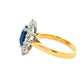 Octagonal Sapphire and round Brilliant Cut Diamond Cluster Style Ring