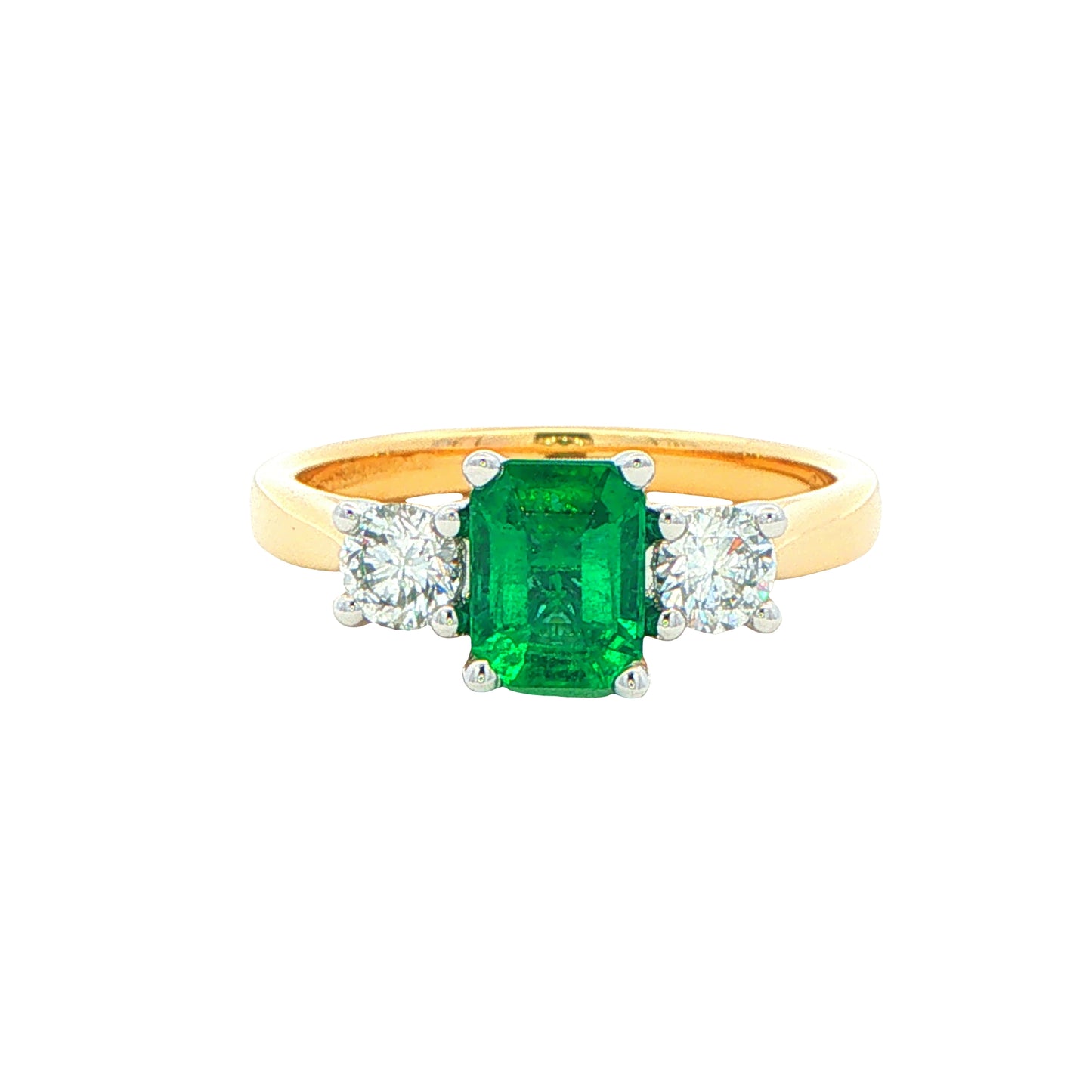 Octagonal Emerald and round brilliant cut diamond 3 stone ring