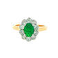 Oval Emerald and Round Brilliant Cut Diamond Cluster Ring