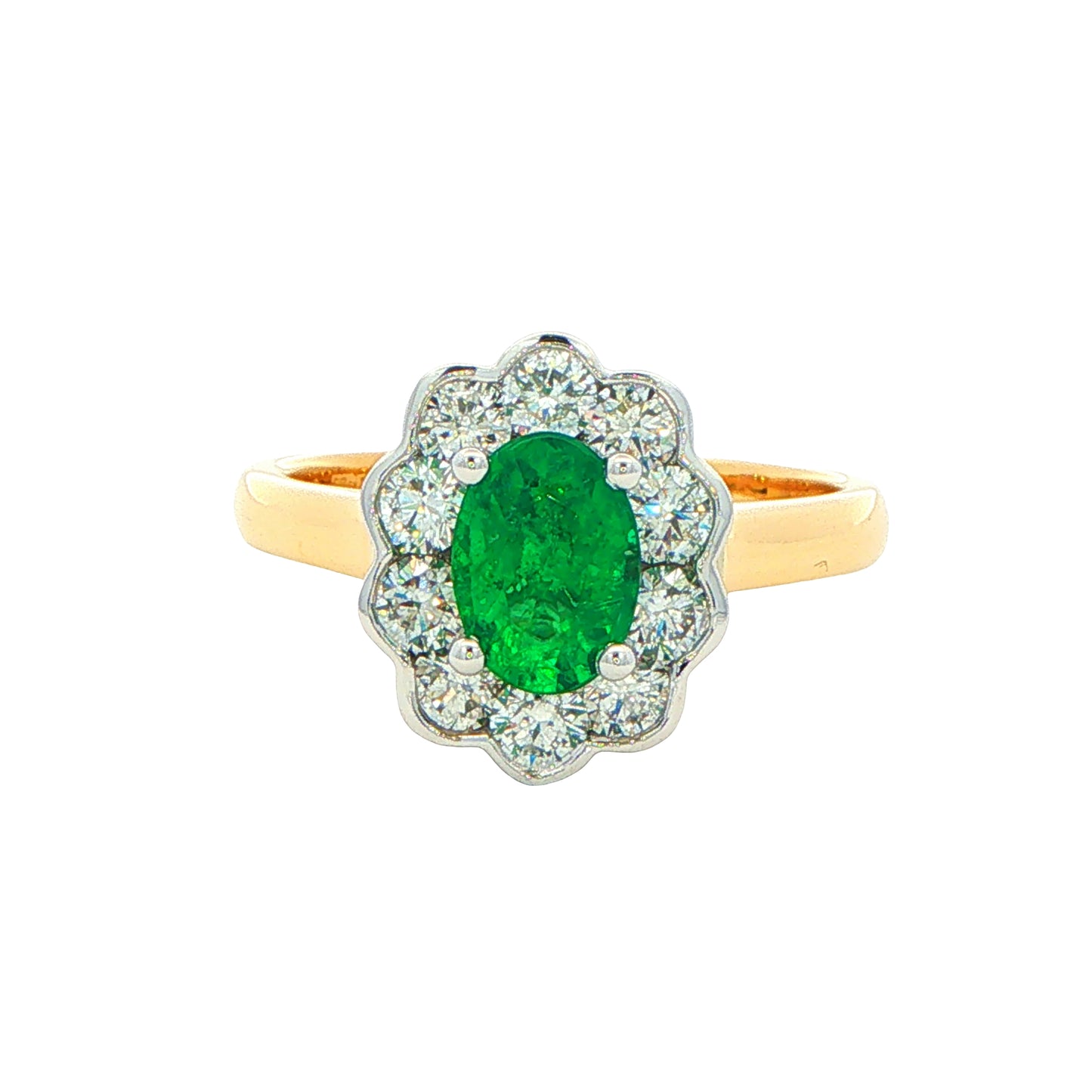 Oval Emerald and Round Brilliant Cut Diamond Cluster Ring