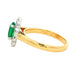 Oval Emerald and Round Brilliant Cut Diamond Cluster Ring