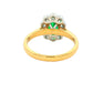 Oval Emerald and Round Brilliant Cut Diamond Cluster Ring