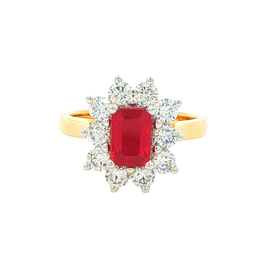 Octagonal shaped ruby and round brilliant cut diamond cluster style ring
