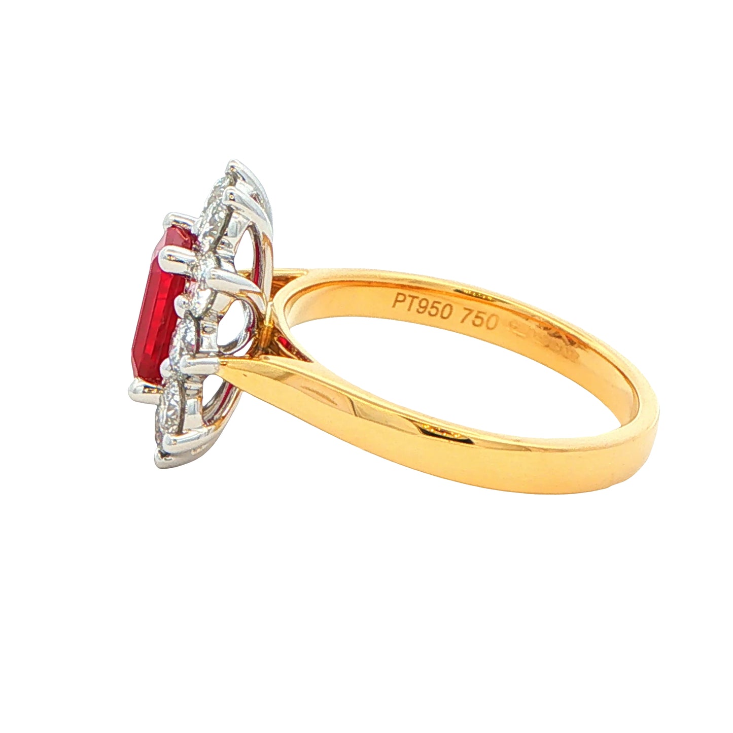 Octagonal shaped ruby and round brilliant cut diamond cluster style ring