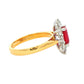Octagonal shaped ruby and round brilliant cut diamond cluster style ring