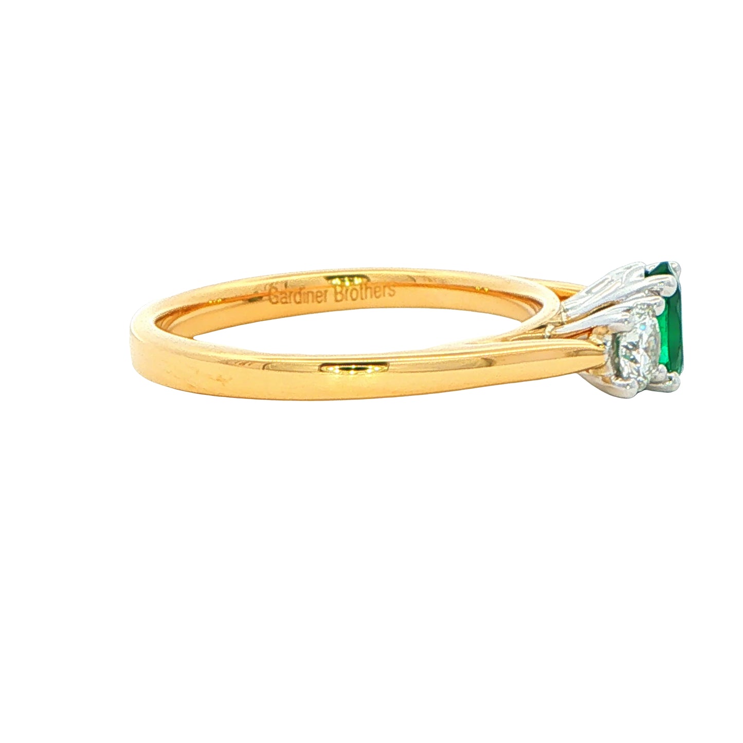 Oval Emerald and round brilliant cut Diamond 3 Stone Ring gardiner-brothers