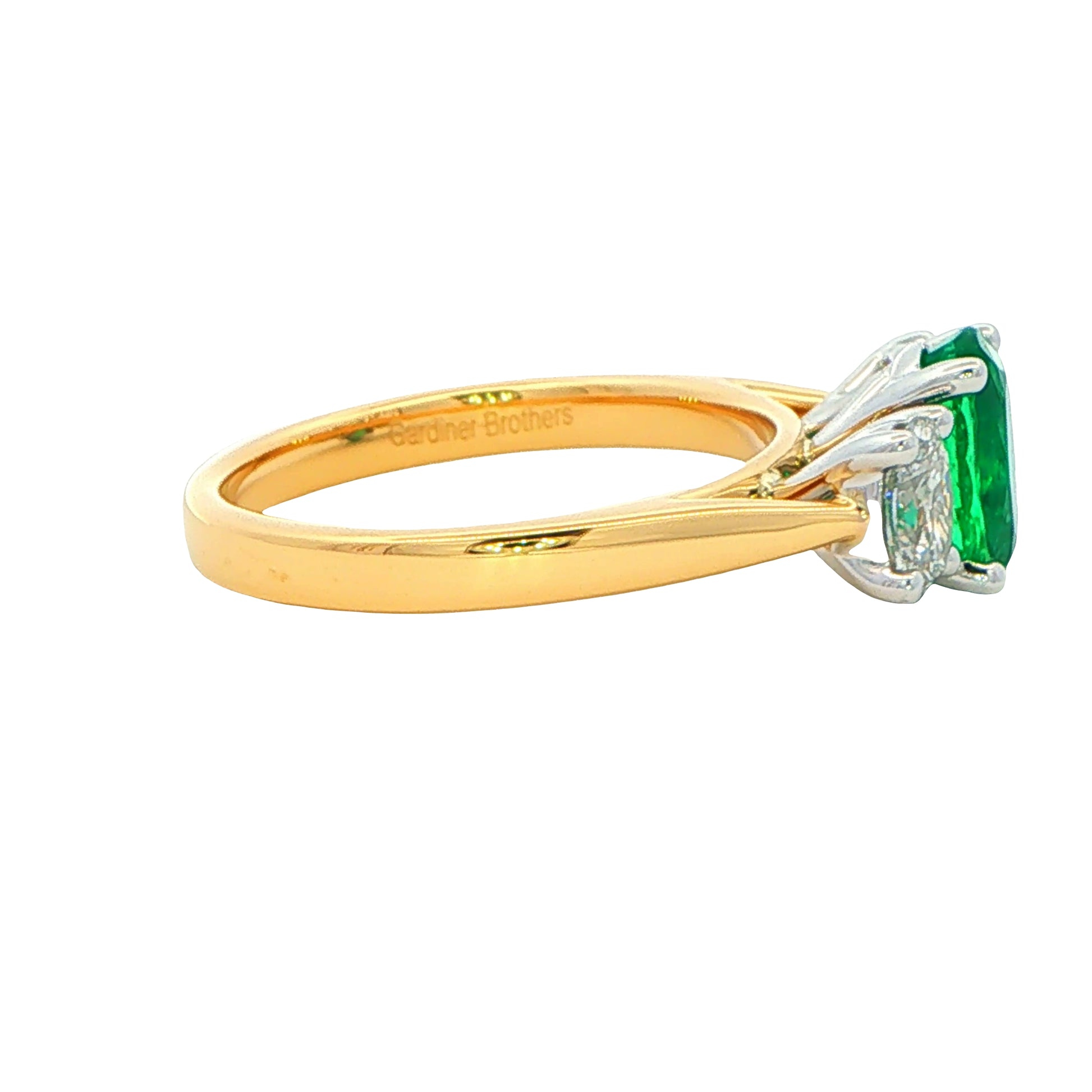 Oval Shaped Emerald and Oval Diamond 3 stone ring Gardiner Brothers