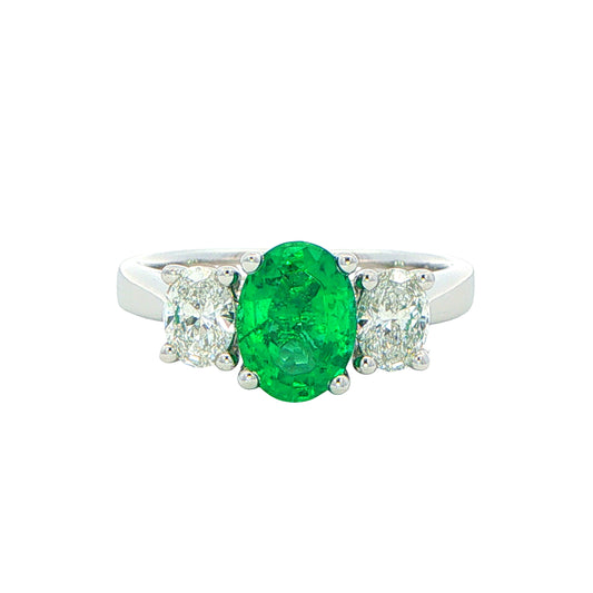 Oval Shaped emerald and oval diamond 3 stone ring