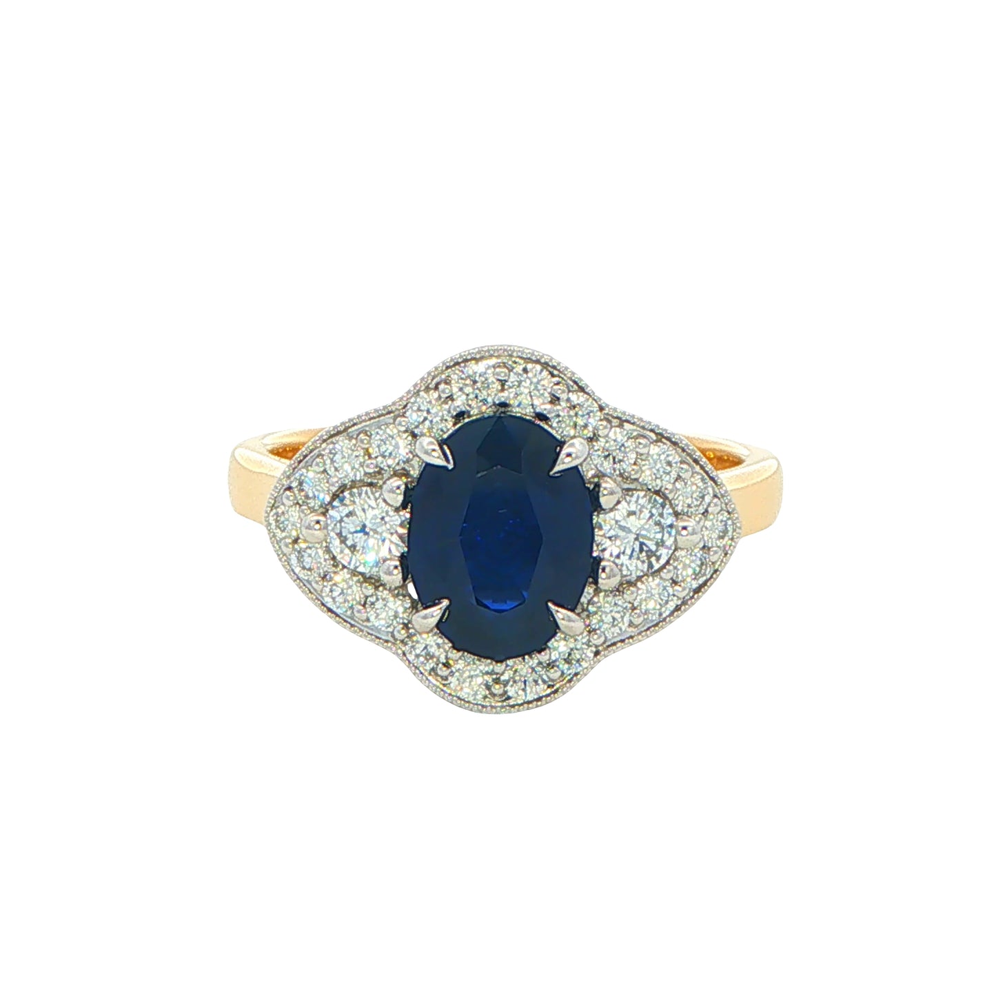 Oval Sapphire and round brilliant cut diamond fancy halo style ring