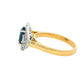 Oval Sapphire and round brilliant cut diamond fancy halo style ring