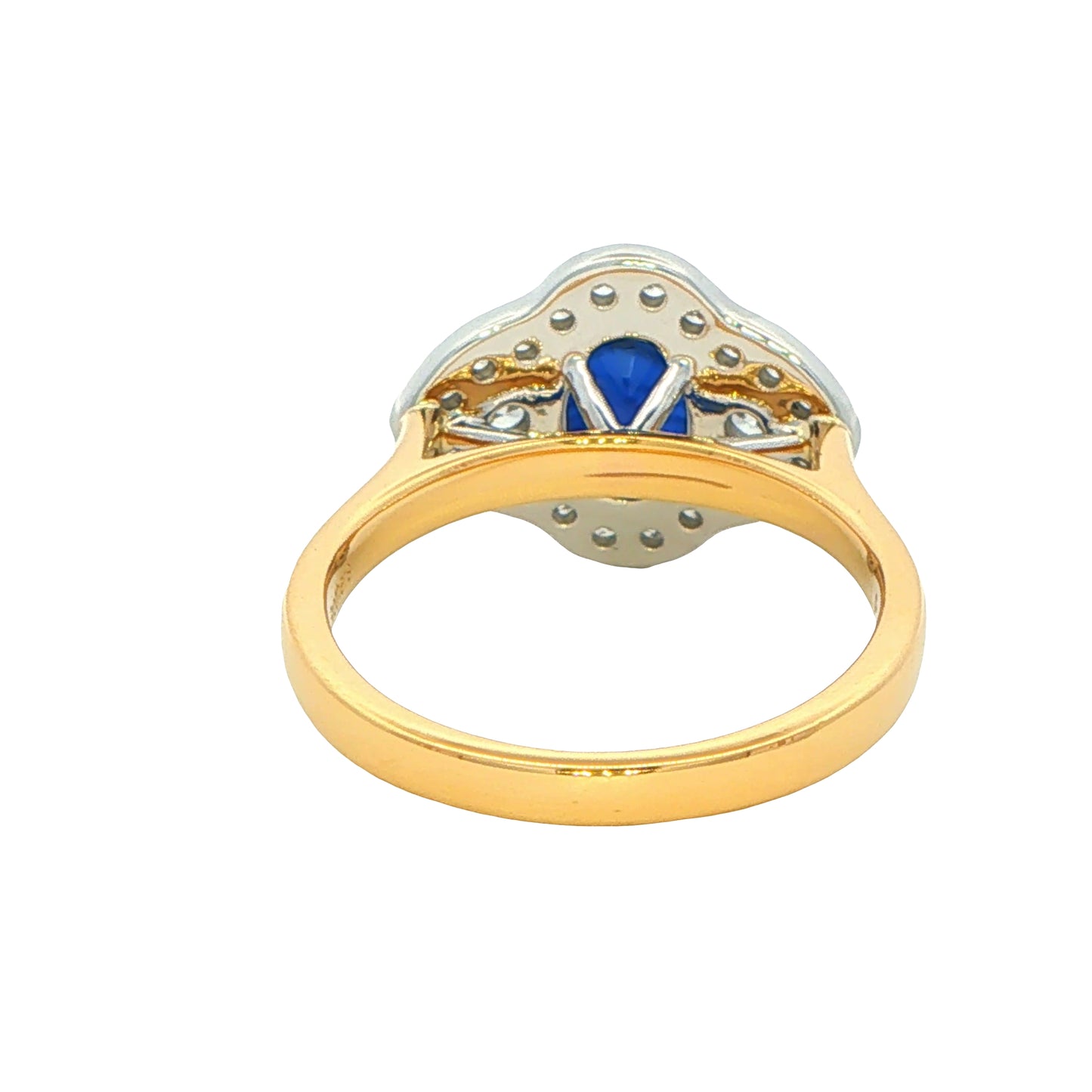Oval Sapphire and round brilliant cut diamond fancy halo style ring