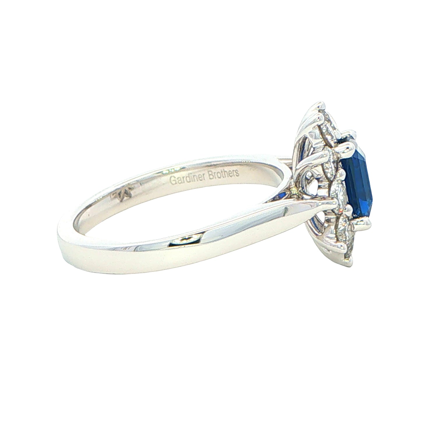 Octagonal Sapphire and round brilliant cut diamond cluster ring