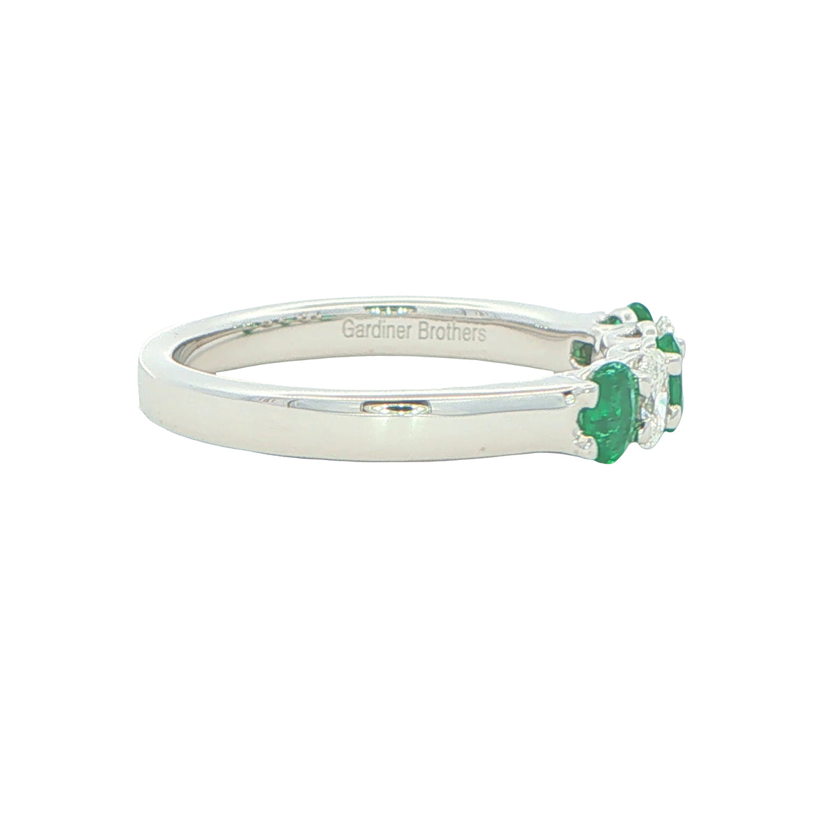 Emerald and diamond oval shaped 5 stone ring