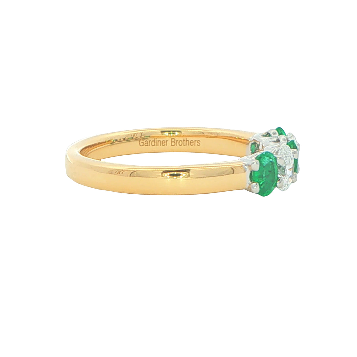 Emerald and diamond oval shaped 5 stone ring