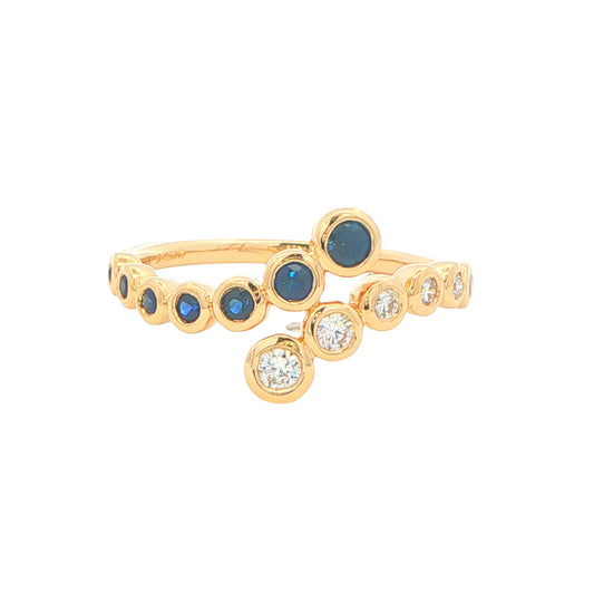 Sapphire and round brilliant cut diamond cross-over ring