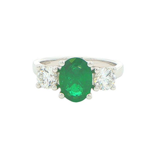 Oval Emerald and round brilliant cut diamond 3 stone ring