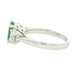 Oval Emerald and round brilliant cut diamond 3 stone ring