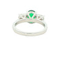 Oval Emerald and round brilliant cut diamond 3 stone ring