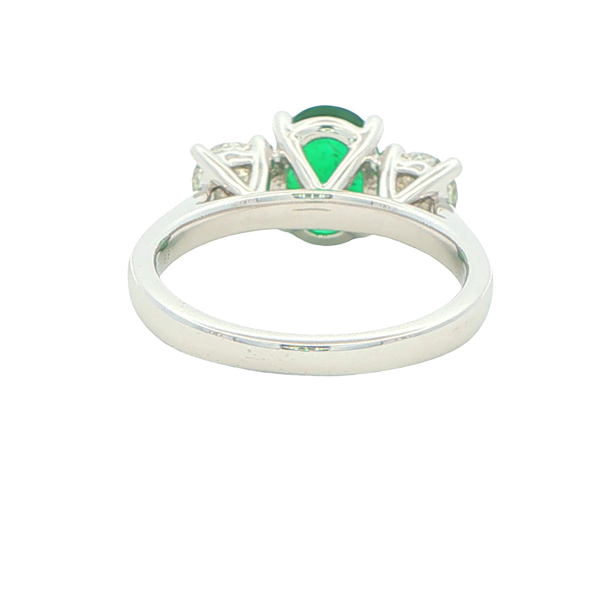 Oval Emerald and round brilliant cut diamond 3 stone ring