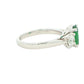 Oval Emerald and round brilliant cut diamond 3 stone ring