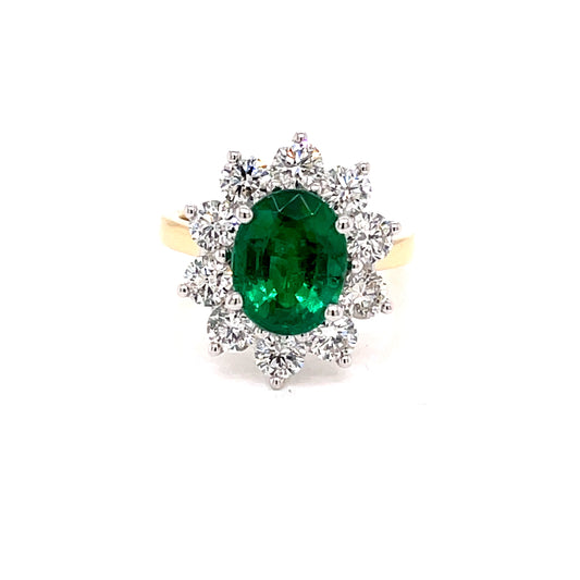 Oval Shaped Emerald and Round Brilliant Cut Diamond Cluster Ring  Gardiner Brothers   