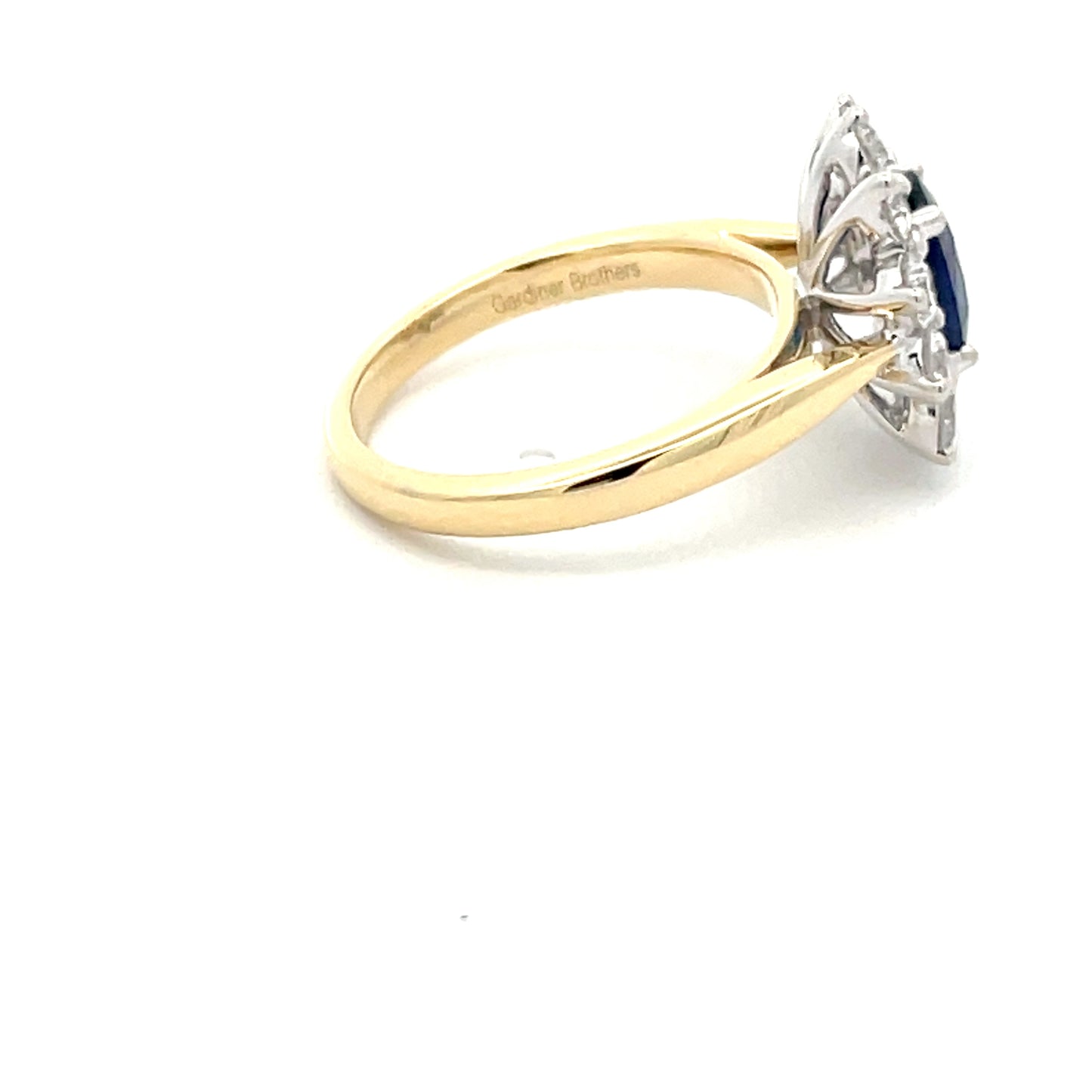 SAPPHIRE AND ROUND BRILLIANT CUT DIAMOND CLUSTER STYLE RING  Gardiner Brothers   