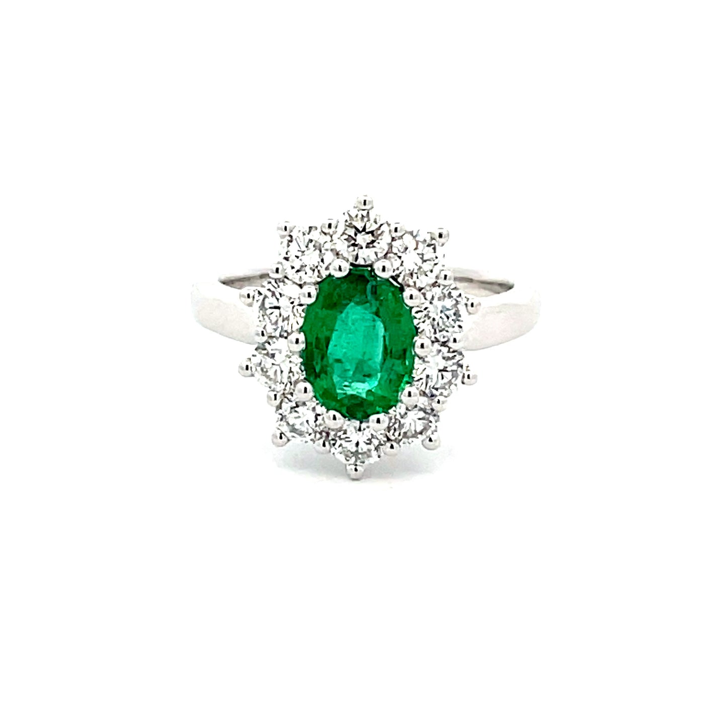 emerald  AND ROUND BRILLIANT CUT DIAMOND CLUSTER STYLE RING  Gardiner Brothers   