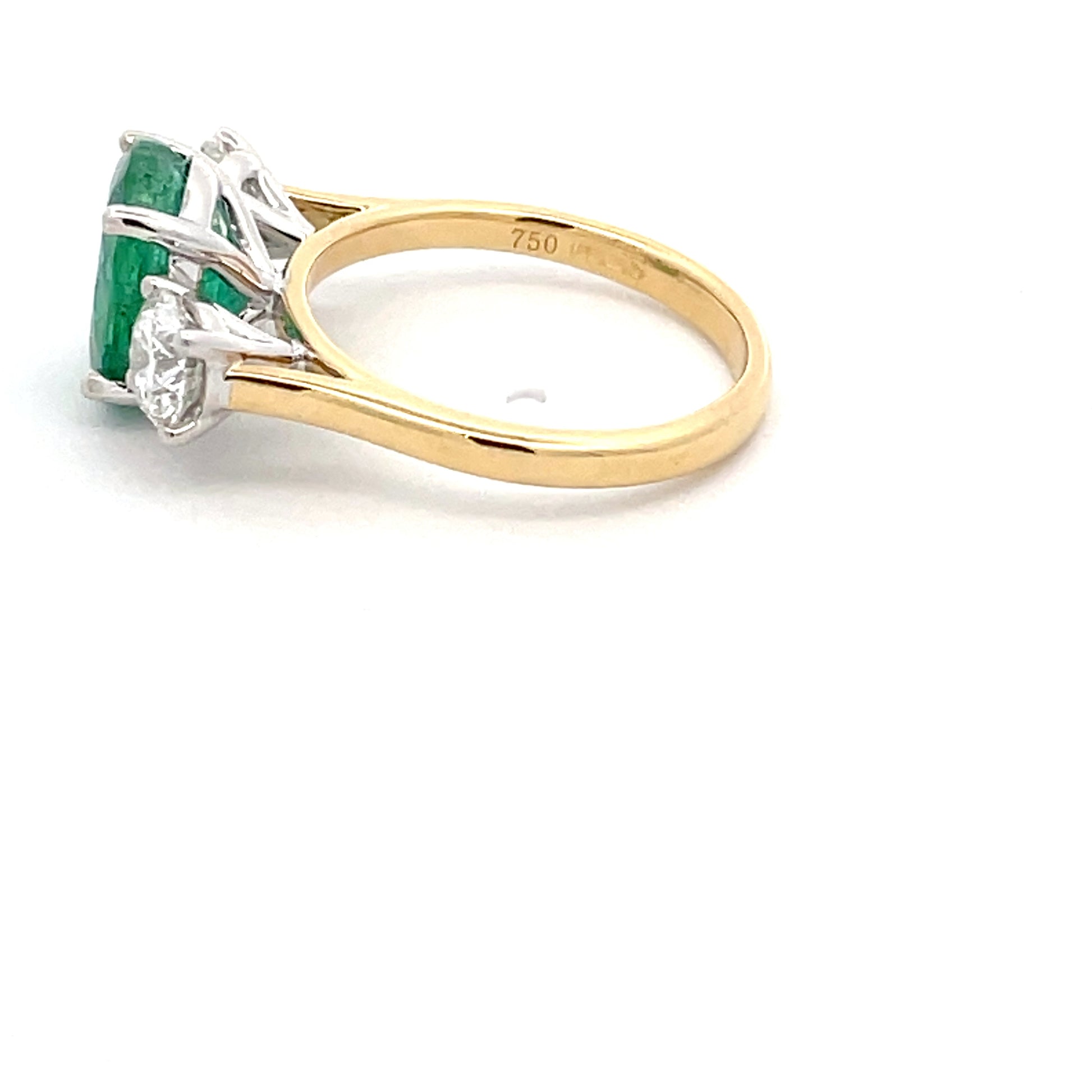 Emerald and round brilliant cut diamond 3 stone ring  Gardiner Brothers   