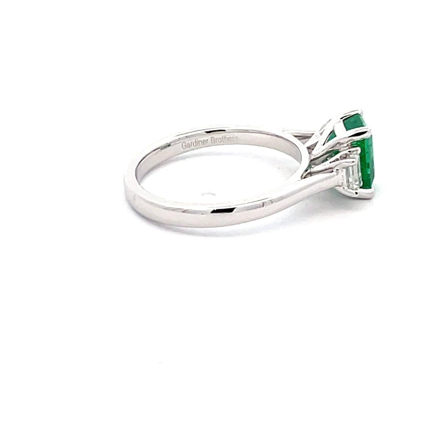 Octagonal emerald and emerald cut diamond 3 stone ring Gardiner Brothers