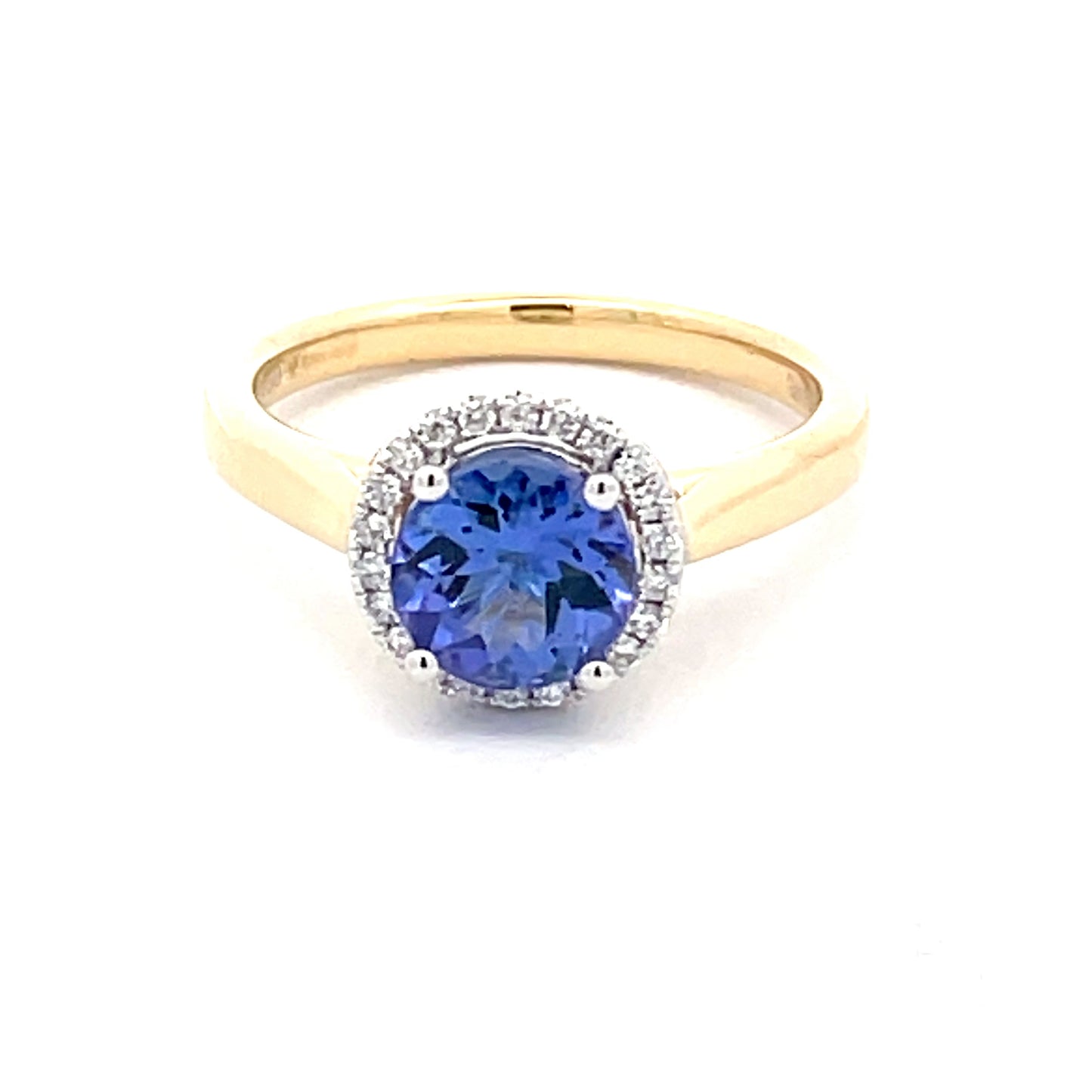 Tanzanite and round brilliant cut diamond halo ring  Gardiner Brothers   