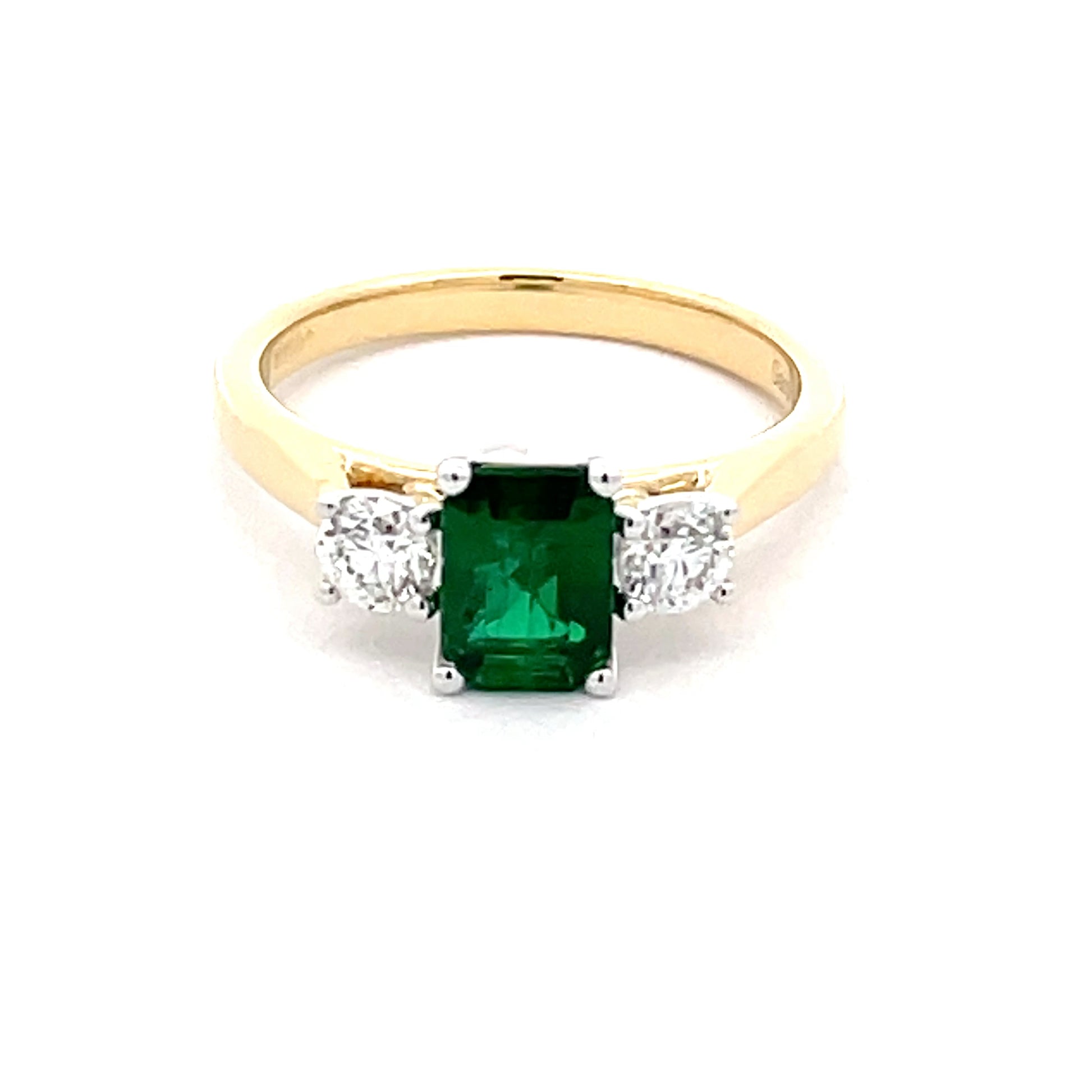 Octagonal Emerald and round brilliant cut diamond 3 stone ring  Gardiner Brothers   