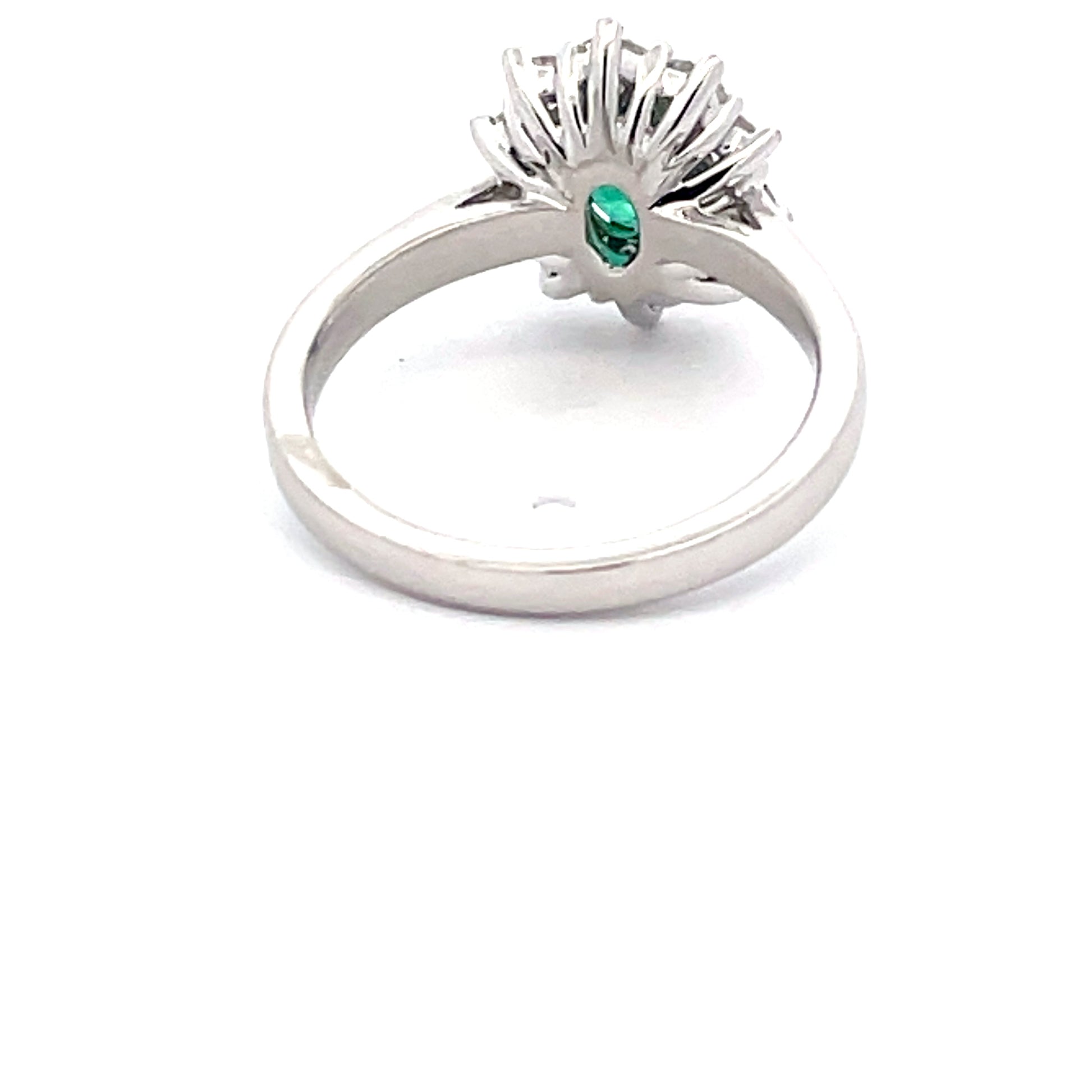 Emerald and round brilliant cut diamond cluster style ring  Gardiner Brothers   