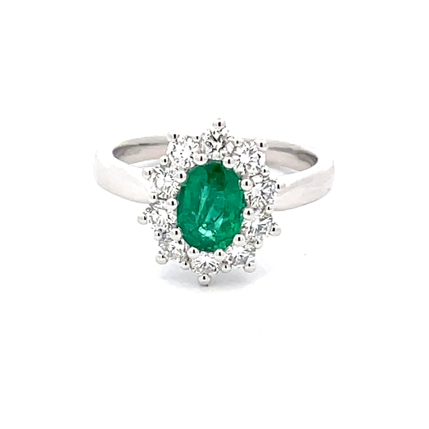 Emerald and round brilliant cut diamond cluster style ring  Gardiner Brothers   