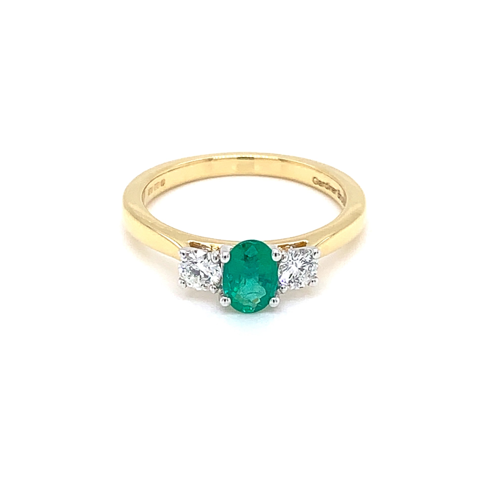 Oval Emerald and round brilliant cut Diamond 3 Stone Ring  gardiner-brothers   